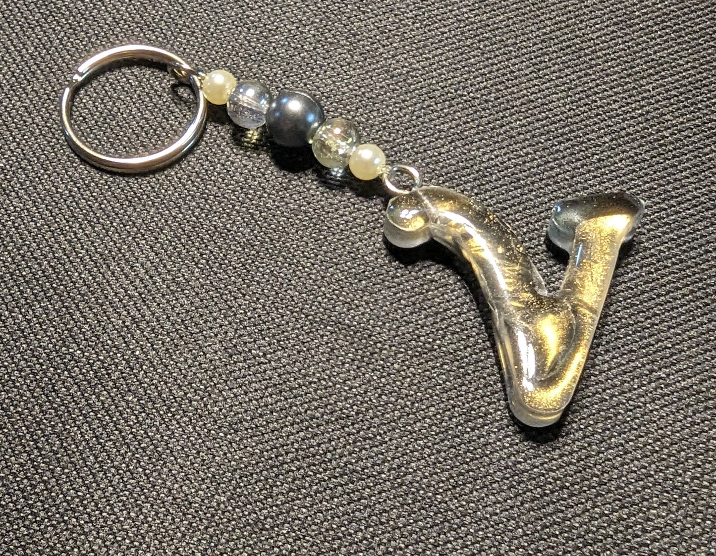 V letter gold beaded keychain