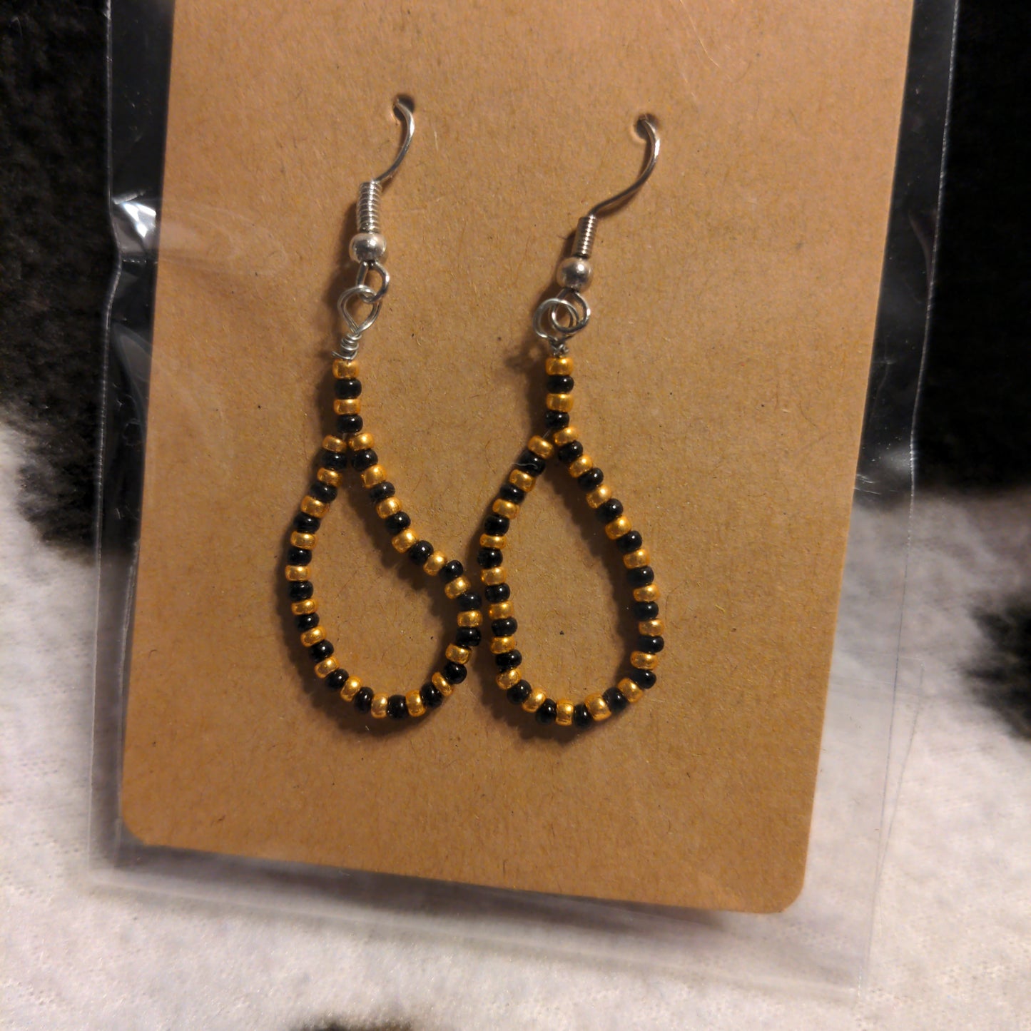 Gold/orange and black teardrop beaded earrings