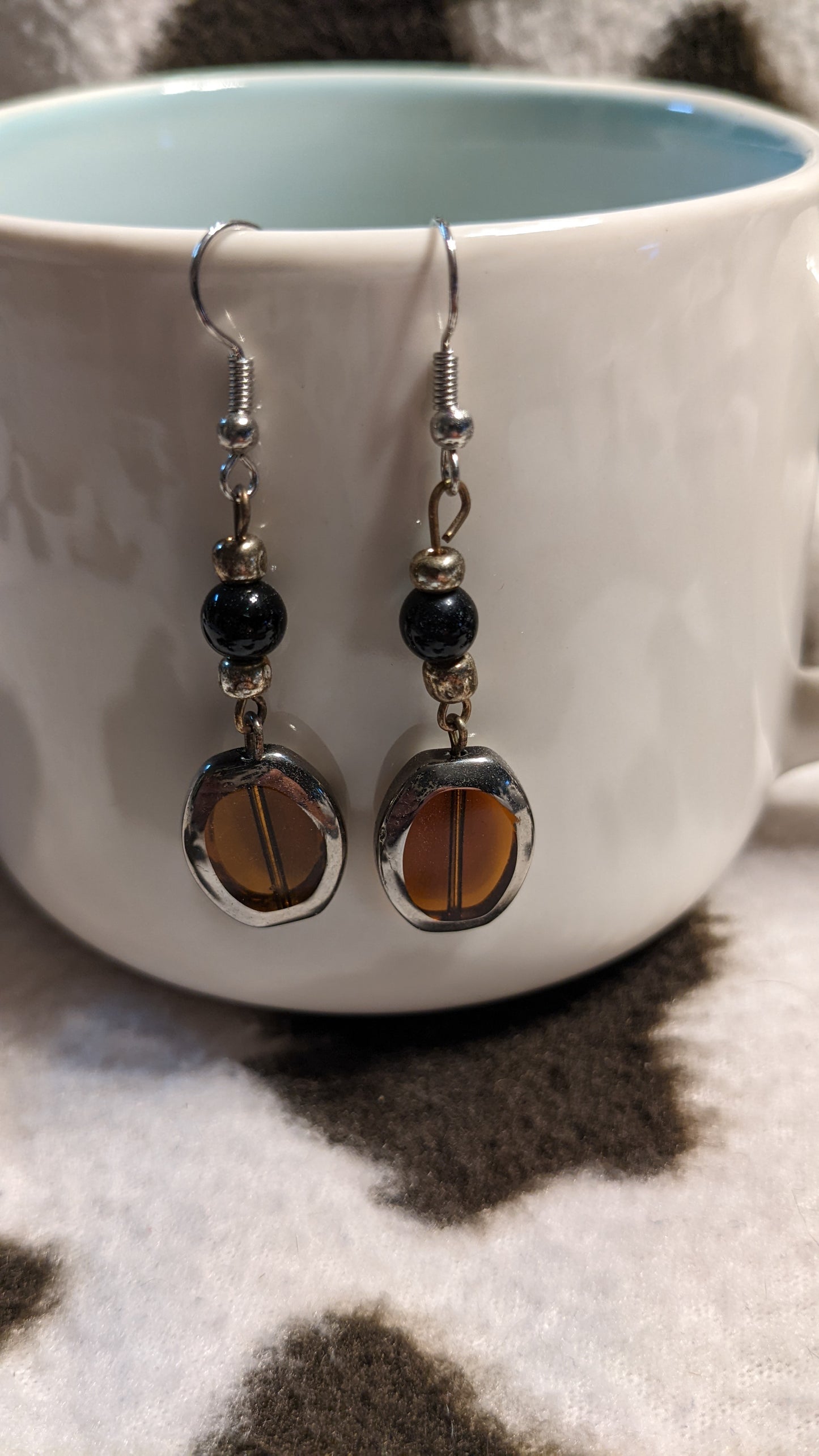 Black, silver and orange dangling earrings