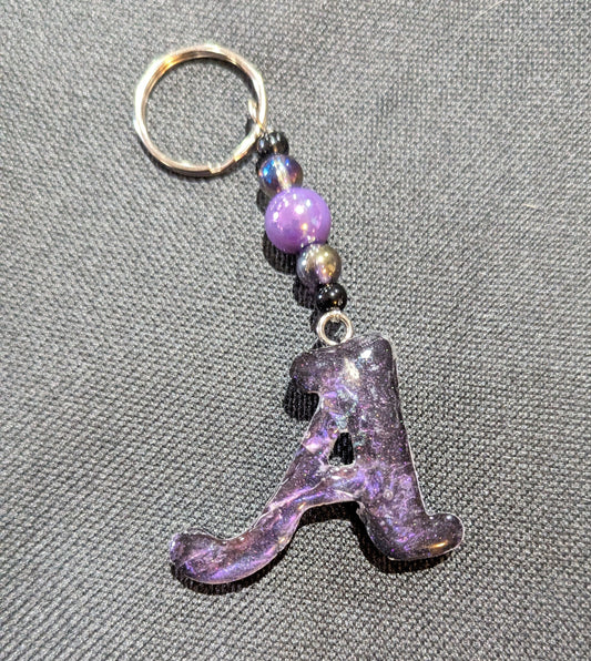 A letter purple beaded keychain