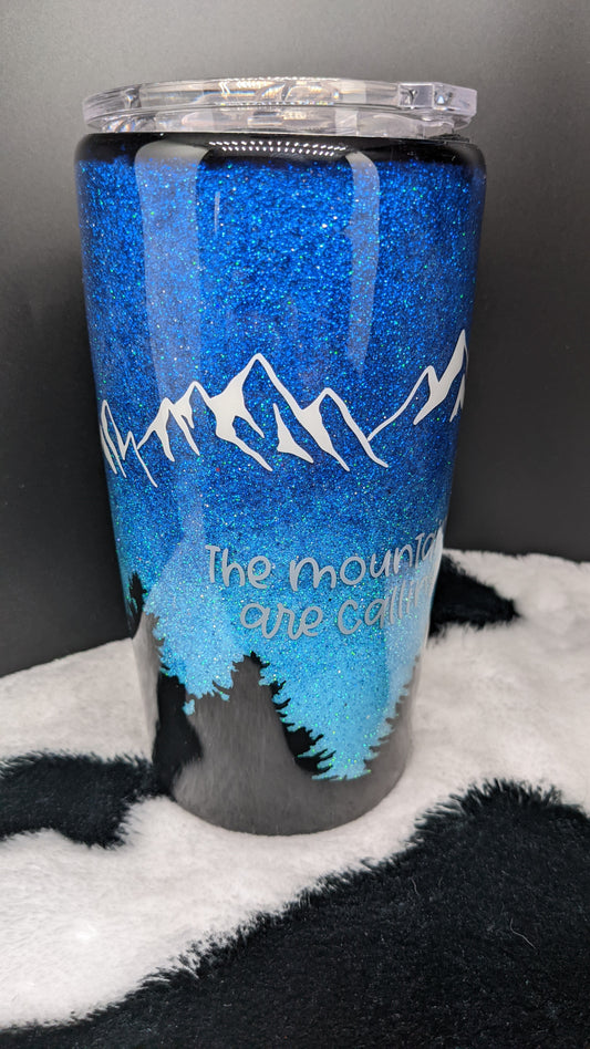 20 oz custom the mountains are calling blue epoxy tumber