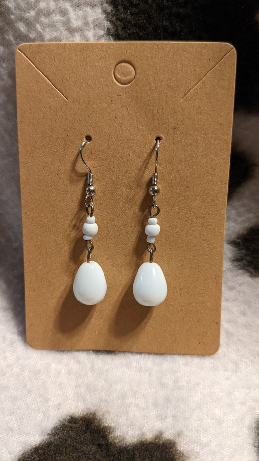 White dangling earrings