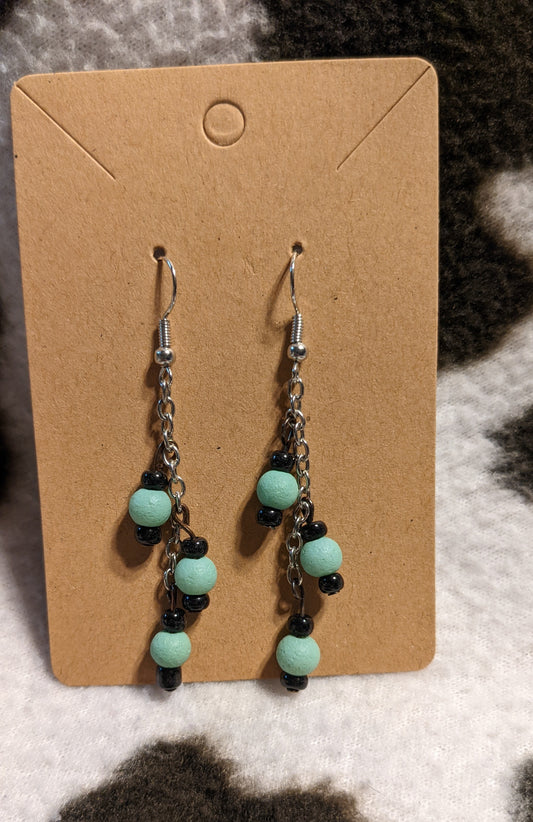 Teal and black dangling earrings