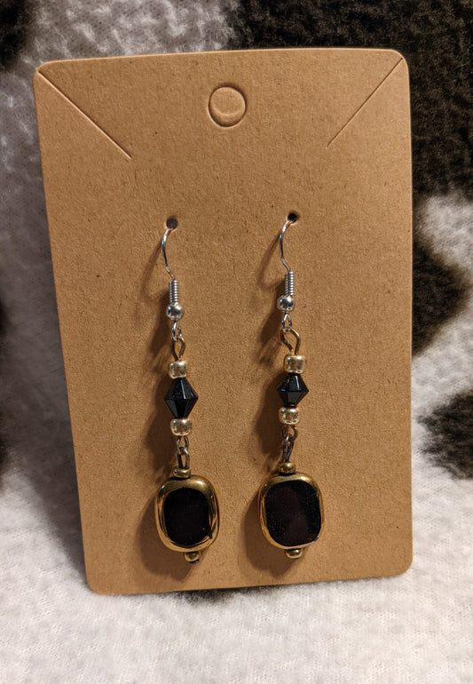 Black and gold dangling earrings