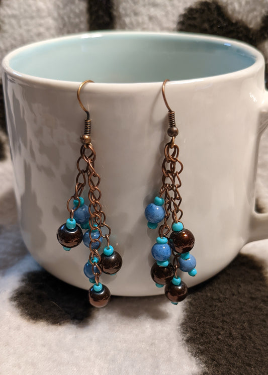 Gold and blue dangling earrings