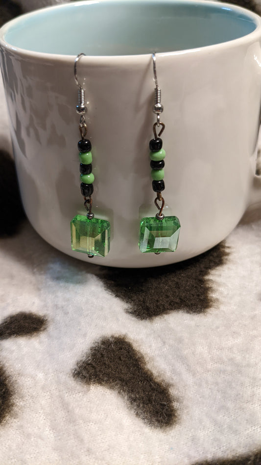 Green and black dangling earrings