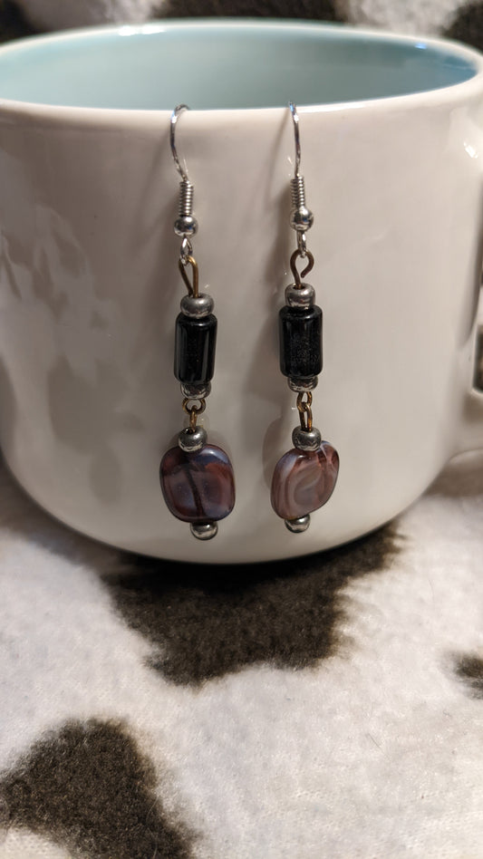 Black and pink/purple dangling earrings