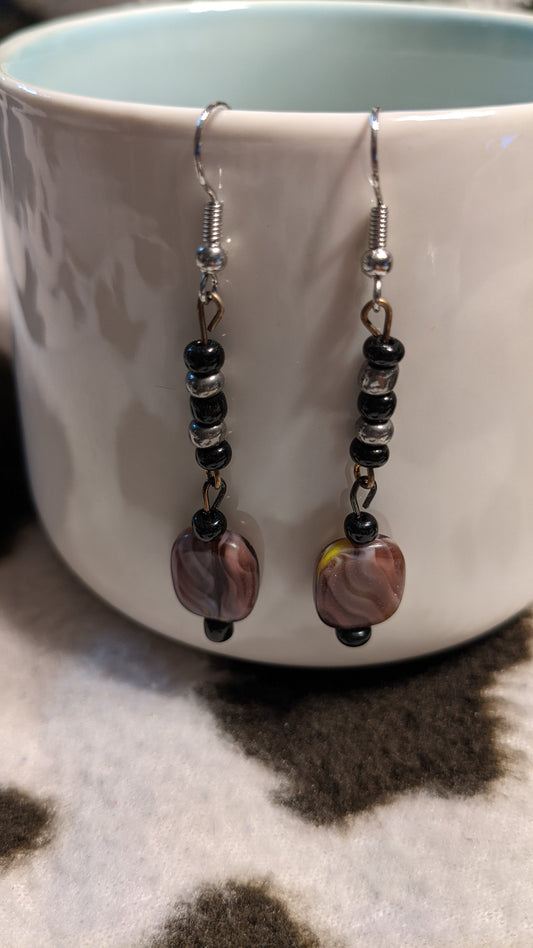 Black silver and purple/pink dangling earrings